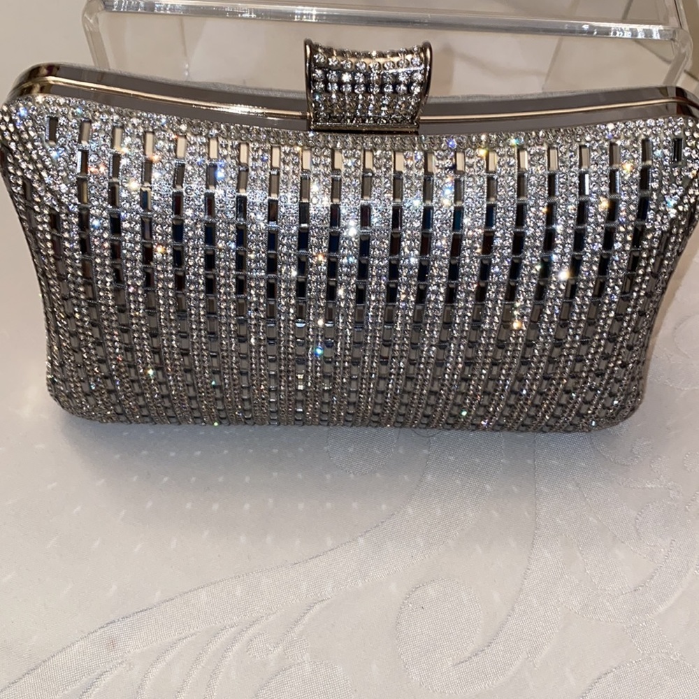 D’margeaux Silver and mirrored clutch used ones